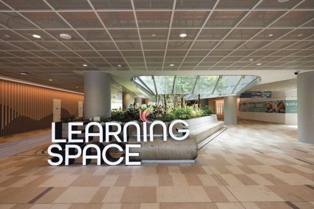 Learning Space with a granite bench set beneath a skylight in the Woodlands Hospital campus