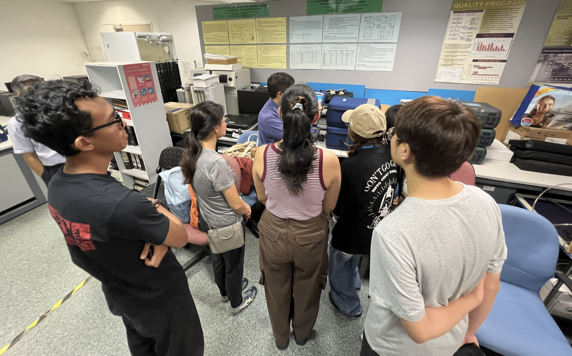 Team members reviewing monitoring data and charts